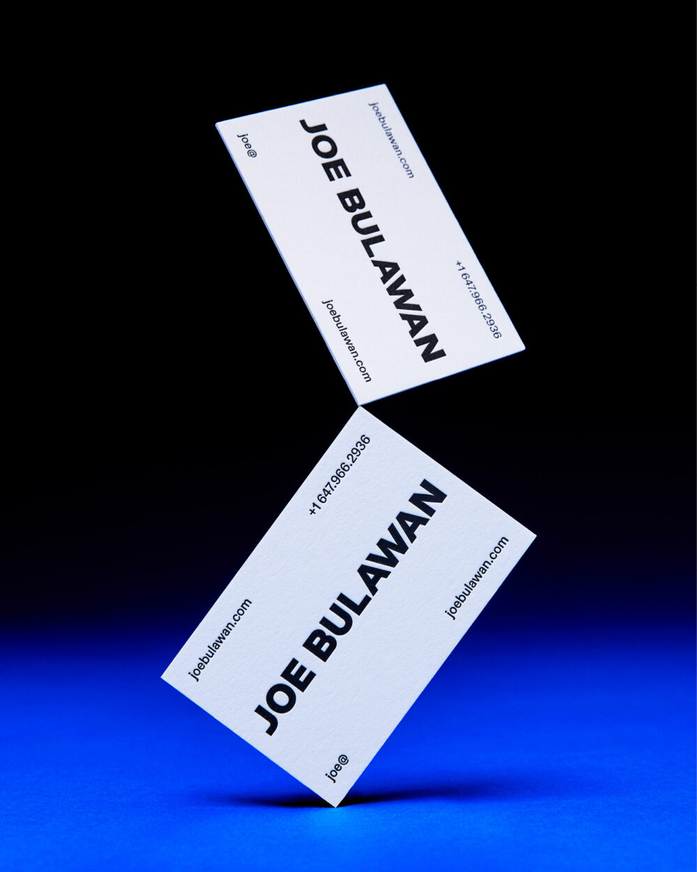 Business card design for Joe Bulawan, showcasing a sleek layout with bold typography and a monochrome colour scheme. Design by Alina Skyson.
